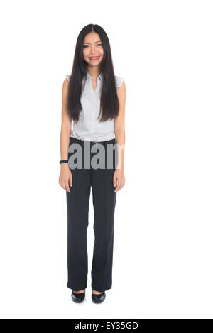 Business woman standing in full length isolated on white background. Beautiful mixed race Chinese female mode in suit. Stock Photo