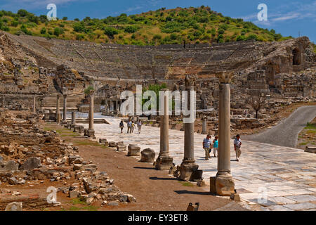 The main street of Ephesus leading down to the old port area which silted up & is now inland. The main amphitheatre is behind. Stock Photo