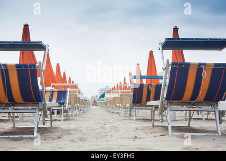 Umbrellas and sunbeds in Rimini and Riccione and Cattolica Beach, Italy Stock Photo