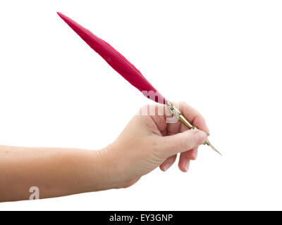 hand holding feather pen Stock Photo