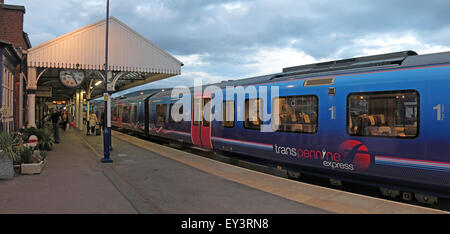 First Transpennine train at platform, Stalybridge Station at dusk, Greater Manchester, England, UK- Class 185 Desiro train Stock Photo