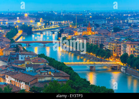 River Adige and bridges in Verona at night, Italy Stock Photo