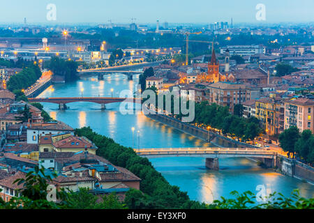 River Adige and bridges in Verona at night, Italy Stock Photo