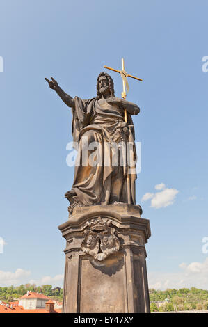 Statue of St. John the Baptist (circa 1857) on the balustrade of famous Charles Bridge in Prague (UNESCO site) Stock Photo