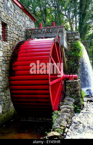 Sudbury, Massachusetts: Old Stone Grist Mill with water wheel and cascade still grinds flour for nearby Longfellow's Wayside Inn Stock Photo