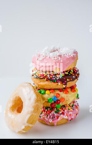 Stack of Assorted Decorated Doughnuts Stock Photo