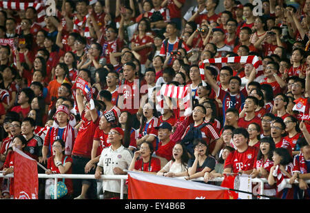 Chinese fans of German Bundesliga soccer club FC Bayern Munich cheer for the team before its pre-season friendly match against Italian club FC Internazionale Milano in Shanghai, China 21 July 2015. Bayern won 1-0. Photo: Xi Ya/dpa CHINA OUT Stock Photo