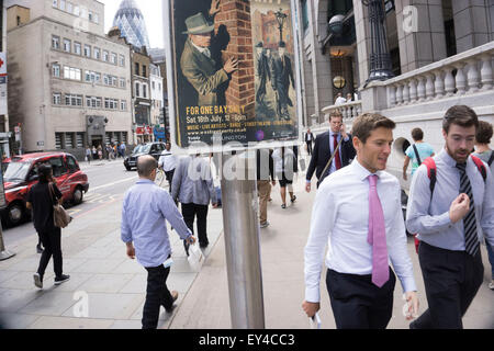 Sinister poster advertising for a club night, looks over the shoulders of passing people near to Liverpool Street station on Bishopsgate. London, UK. The character on the poster is that of a 1940s secret agent, private investigator or spy looking at his target. Stock Photo