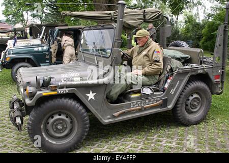 military veterans and World War II US Army Jeep on display at vilage near germany border Stock Photo