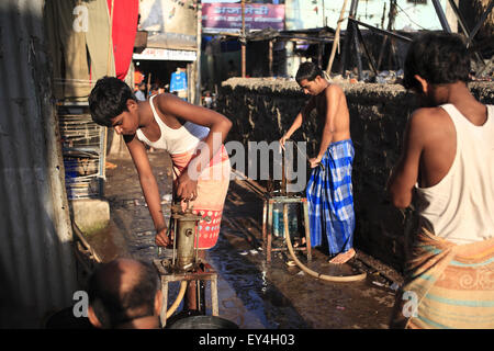 Mumbai, India. 10th Feb, 2010. 2 nov. 2008 : Mumbai - INDIA.Illegal Hand pump is used to siphon off water from the BMC water lines at Dharavi, one of the worst affected part of Mumbai. The local goons in convenience with the local officials put illegal pumps and connection to siphon off water from BMC pipelines. As per Water.org- 'Poor people living in the slums often pay 5-10 times more per litre of water than wealthy people living in the same city. The economically poor markets in the Urban Slums & rural villages in India are becoming increasingly important for big Multinational comp Stock Photo