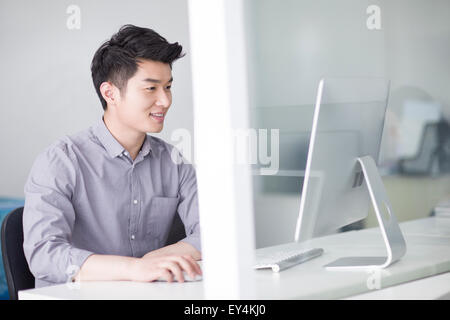 Young businessman working in office Stock Photo