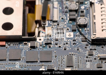 Inside the old computer. Electronic components of old laptop. Stock Photo