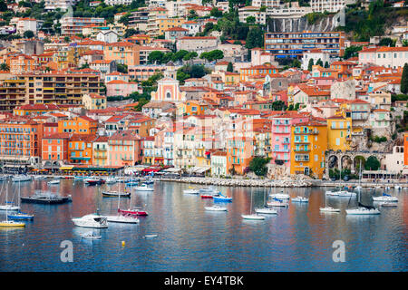 VILLEFRANCHE-SUR-MER, FRANCE - OCTOBER 1, 2014: Colorful waterfront of picturesque French Riviera town with leisure boats anchor Stock Photo