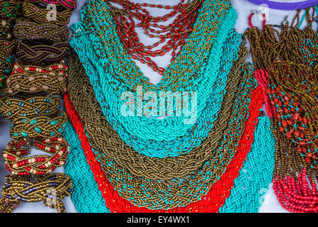 Colorful beaded necklaces and other native jewelries at local market. Otavalo, Ecuador. Stock Photo