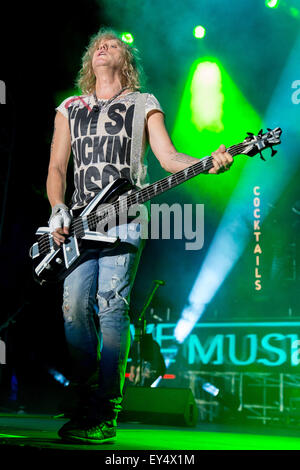 Bassist Rick Savage performs with Def Leppard on stage during their ...