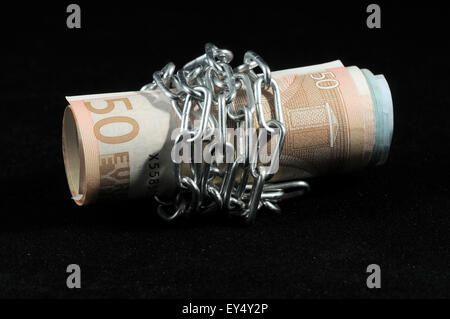 Money in chains Stock Photo