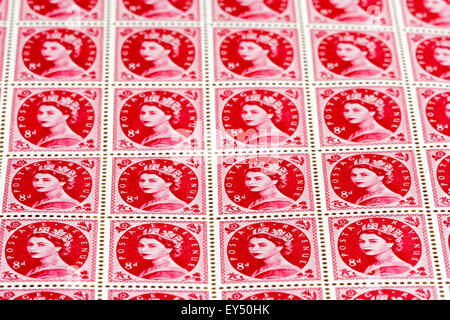Sheet of British postage stamps. Circa 1950s, Queen Elizabeth 8d rose colour 'wilding' definitive stamp issue. In use from 1952 to 1967. Iconic. Stock Photo