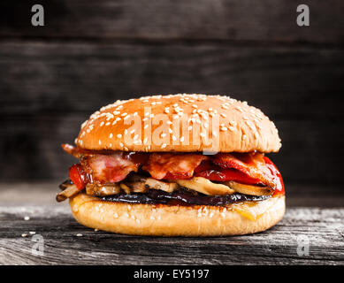 Burger with bacon and vegetables Stock Photo