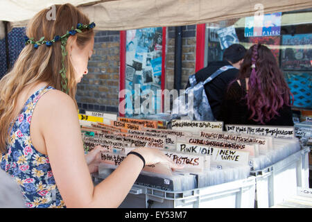 Girl looking though vinyl records in Camden Stables Market, London, UK Stock Photo