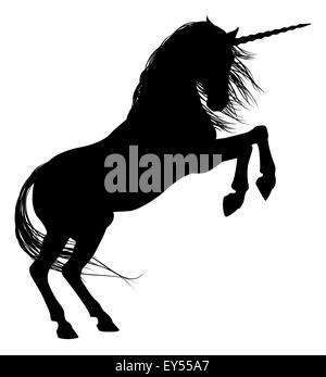 Unicorn mythical horse in silhouette rearing on hind legs Stock Photo