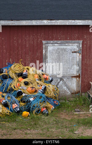 Different coloured Buoy's and rope outside a fishermans hut in Nova Scotia. Stock Photo