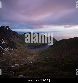 Mountain view at midnight from Nonstind mountain peak, Vestvågøy, Lofoten Islands, Norway Stock Photo