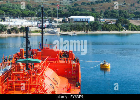 Red LPG tanker does mooring operations in Port of Ajaccio, Corsica, France Stock Photo