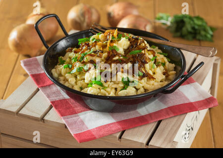 Käsespätzle. Cheese noodles and roasted onions. Germany Austria Food Stock Photo
