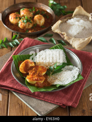 Egg curry and string hoppers. Sri Lanka and South India Food Stock Photo