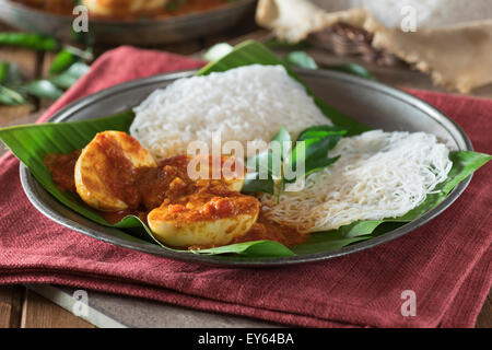 Egg curry and string hoppers. Sri Lanka and South India Food Stock Photo