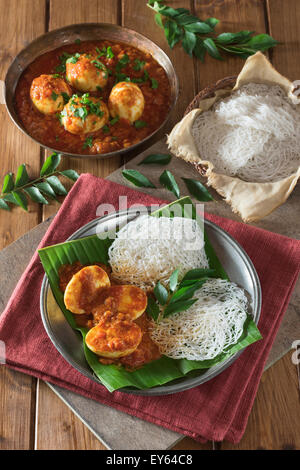 Egg curry and string hoppers. Sri Lanka and South India Food Stock Photo