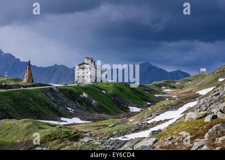 The Petit-Saint-Bernard hospice and statue of Saint Bernard de Menthon at the Little St Bernard Pass in the French Italian Alps Stock Photo