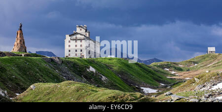 The Petit-Saint-Bernard hospice and statue of Saint Bernard de Menthon at the Little St Bernard Pass in the French Italian Alps Stock Photo