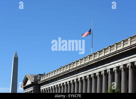 Washington, DC, USA. 21st July, 2015. A national flag of United States flies at half-staff at the Treasury Department in Washington, DC, July 21, 2015. US President Barack Obama ordered Tuesday that flags be lowered to half-staff at federal buildings across the country until July 25 to honor the military service members killed last week in Chattanooga, Tennessee. Credit:  Yin Bogu/Xinhua/Alamy Live News Stock Photo