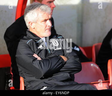 Wrexham, UK. 22nd July July, 2015. Stoke City manager Mark Hughes in the dugout ahead of the pre season friendly between Wrexham and Stoke City at The Racecourse Ground, Wrexham. Credit:  SJN/Alamy Live News Stock Photo
