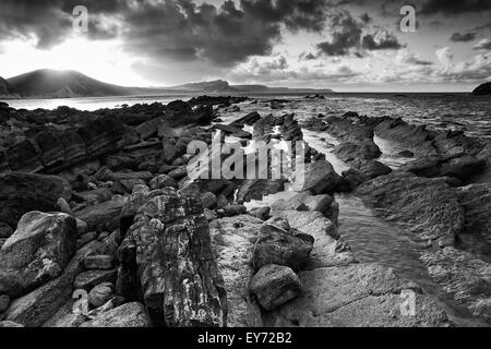 Beautiful sunrise landscape over Mupe Bay on Jurassic Coast in Dorset, England  black and white Stock Photo