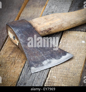 Sharp axe on wooden background Stock Photo - Alamy