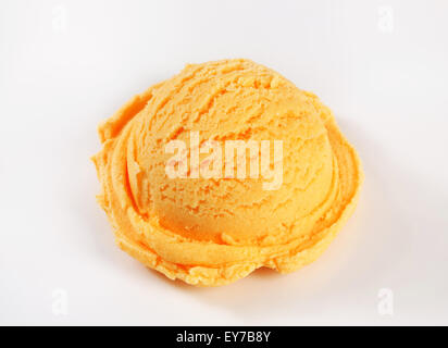 Scoop of orange ice cream Stock Photo