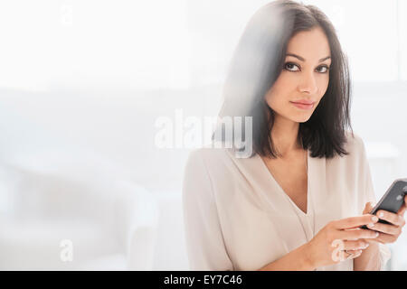 Woman using smart phone Stock Photo