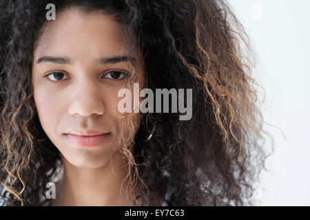 Portrait of teenage girl (16-17) on white background Stock Photo