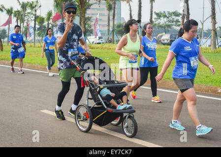 Participants running during  'Pocari Sweat Run Indonesia 2015' in Tangerang, Banten, Indonesia.