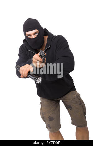 Man in black mask and black cloth holding flashlight and gun isolated on white background. Dangerous criminal committing crime. Stock Photo