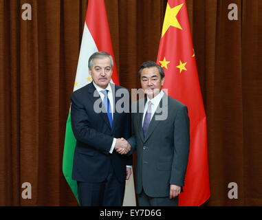 Beijing, China. 23rd July, 2015. Chinese Foreign Minister Wang Yi (R) holds talks with visiting Tajik Foreign Minister Sirojiddin Aslov in Beijing, capital of China, July 23, 2015. © Ding Haitao/Xinhua/Alamy Live News Stock Photo