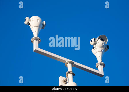 CCTV cameras on beach seafront at Sandbanks, Dorset UK for security surveillance crime reduction deterrent Stock Photo