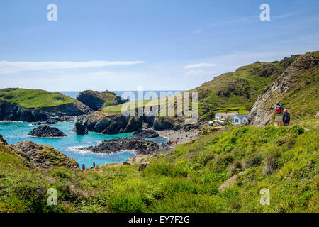 Kynance Cove, Lizard Peninsula, West Cornwall, England, UK with walkers on the South West Coast Path Stock Photo
