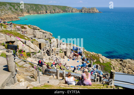 The Minack Theatre overlooking the sea at Porthcurno near Penzance, Cornwall, England, UK - with people watching a performance Stock Photo