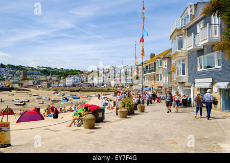 St Ives, Cornwall, UK with tourists walking on the promenade in summer Stock Photo