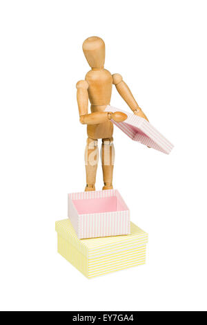 Wooden mannequin opens little box Stock Photo