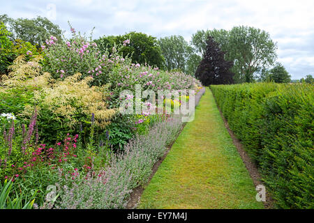 The herbaceous border of Oxburgh Hall ablaze with color, Oxborough, Norfolk, East Anglia, England, United Kingdom. Stock Photo