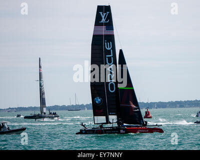 Portsmouth, England, July 23rd 2015. Oracle team USA and Land Rover BAR team in action during the first practice session of the Americas Cup World Series in the Solent. The Americas Cup World Series takes place in Portsmouth between the 23 July and the 26th July 2015 Credit:  simon evans/Alamy Live News Stock Photo